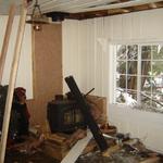 wood stove and surrounding ceiling damage
